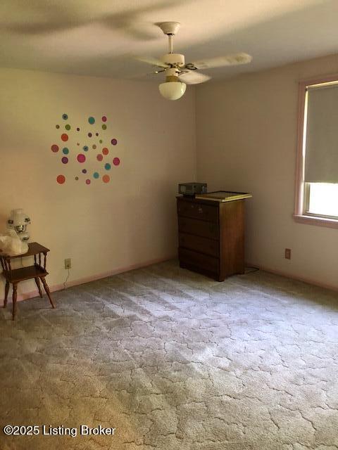 8907 Lakeridge Dr, Louisville, KY 40272 - unfurnished bedroom with light colored carpet and ceiling fan