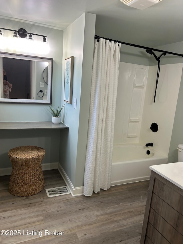 4908 Fielding Way, Louisville, KY 40216 - full bath featuring wood finished floors, vanity, baseboards, and shower / bath combination with curtain