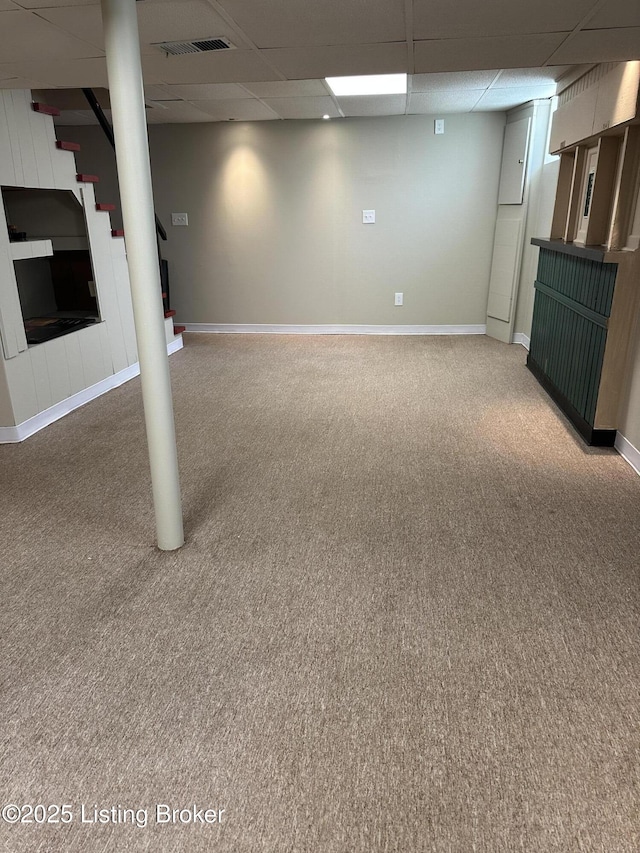 4908 Fielding Way, Louisville, KY 40216 - finished below grade area with light colored carpet, stairs, a drop ceiling, and baseboards