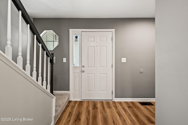 10707 Hickory Cove Ct, Louisville, KY 40245 - entryway featuring wood finished floors, baseboards, and stairs