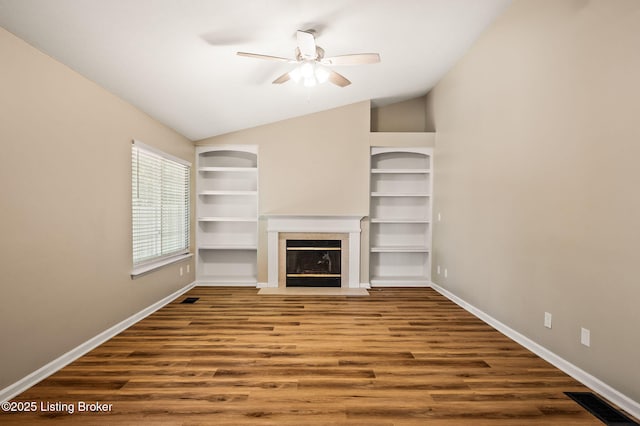 10707 Hickory Cove Ct, Louisville, KY 40245 - unfurnished living room with vaulted ceiling, ceiling fan, a fireplace with flush hearth, baseboards, and wood finished floors