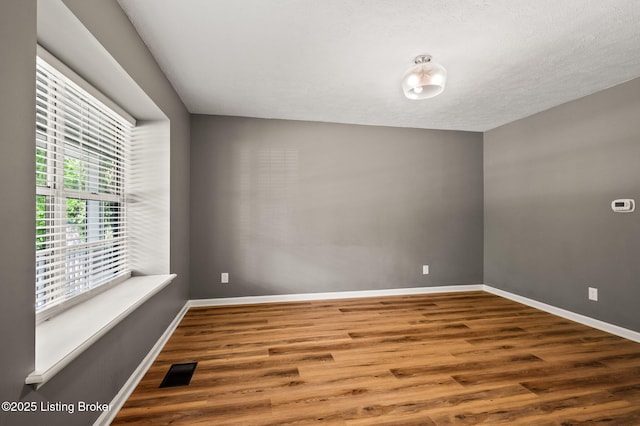10707 Hickory Cove Ct, Louisville, KY 40245 - empty room with wood finished floors and baseboards