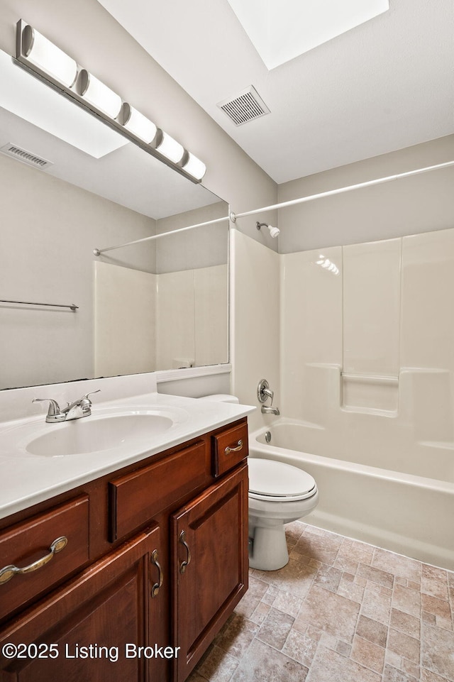 10707 Hickory Cove Ct, Louisville, KY 40245 - bathroom with stone finish flooring, toilet, vanity, and bathing tub / shower combination