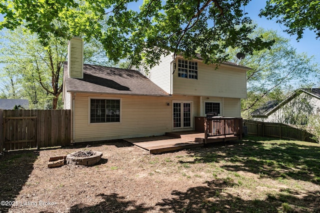 10707 Hickory Cove Ct, Louisville, KY 40245 - rear view of property with a fire pit, a wooden deck, and a chimney