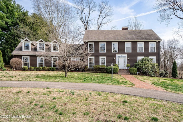 1309 S Buckeye Ln, Goshen, KY 40026 - colonial house featuring a chimney, a front yard, and roof with shingles