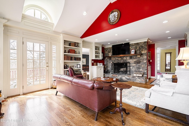 1309 S Buckeye Ln, Goshen, KY 40026 - living room with a stone fireplace, wood finished floors, crown molding, lofted ceiling, and recessed lighting