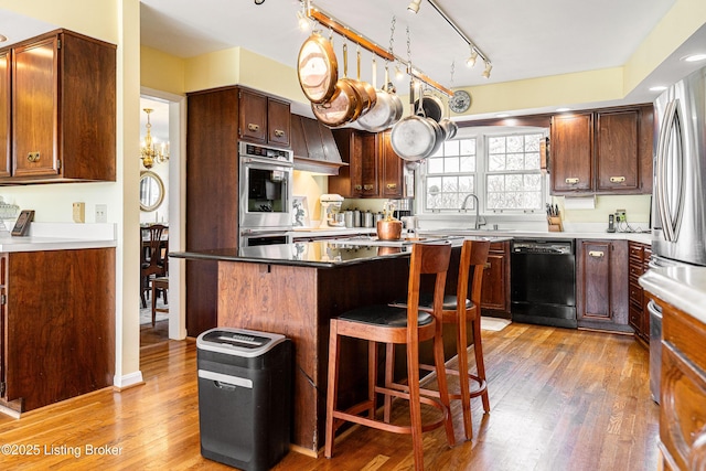 1309 S Buckeye Ln, Goshen, KY 40026 - kitchen featuring dishwasher, a sink, stainless steel double oven, and light wood finished floors