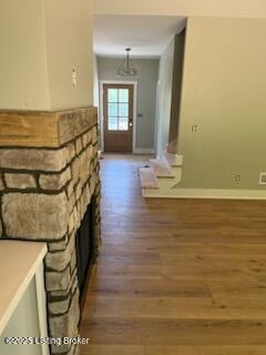 7001 Stable Ct, Crestwood, KY 40014 - hallway with wood finished floors and baseboards