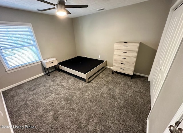 2512 S 4th St, Louisville, KY 40208 - bedroom featuring dark carpet, a textured ceiling, baseboards, and ceiling fan