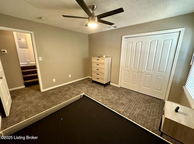 2512 S 4th St, Louisville, KY 40208 - unfurnished bedroom featuring dark carpet, a textured ceiling, a closet, baseboards, and ceiling fan