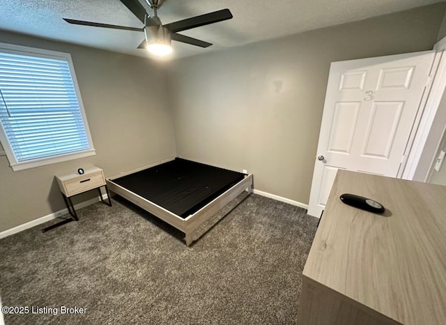 2512 S 4th St, Louisville, KY 40208 - bedroom with baseboards, dark colored carpet, and a ceiling fan