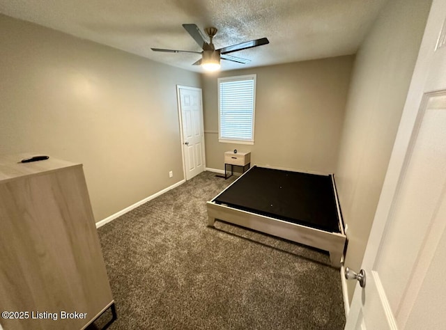 2512 S 4th St, Louisville, KY 40208 - unfurnished bedroom featuring baseboards, dark colored carpet, a textured ceiling, and ceiling fan