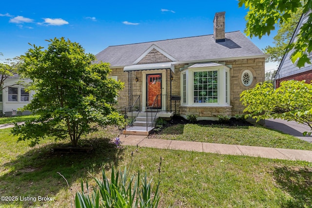 3128 Eagle Pass, Louisville, KY 40213 - view of front of property with stone siding, a front yard, roof with shingles, and a chimney