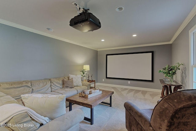 home theater room featuring carpet flooring, baseboards, recessed lighting, and ornamental molding