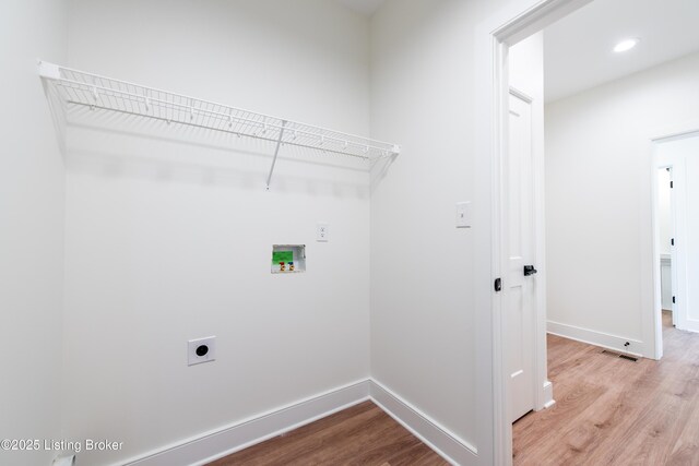 4227 Stilger Cir, Louisville, KY 40299 - laundry room featuring hookup for a washing machine, wood finished floors, electric dryer hookup, baseboards, and recessed lighting