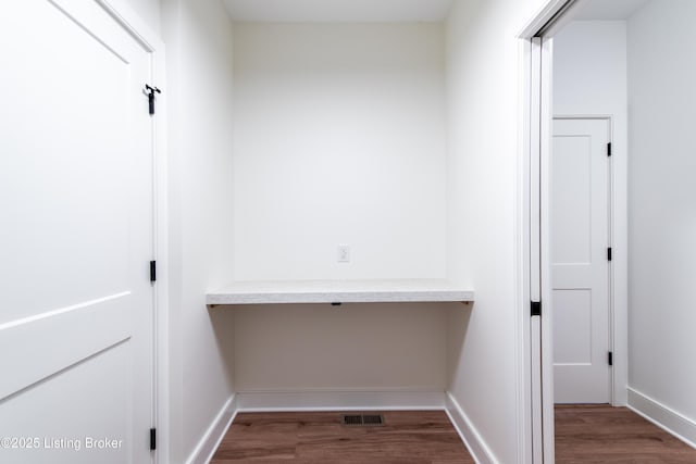 4227 Stilger Cir, Louisville, KY 40299 - laundry room with wood finished floors, baseboards, and a desk