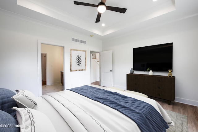 4227 Stilger Cir, Louisville, KY 40299 - bedroom with a raised ceiling, wood finished floors, recessed lighting, crown molding, and ceiling fan
