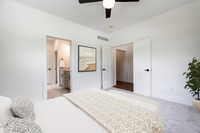 4227 Stilger Cir, Louisville, KY 40299 - bedroom featuring baseboards, ensuite bath, a ceiling fan, and light colored carpet