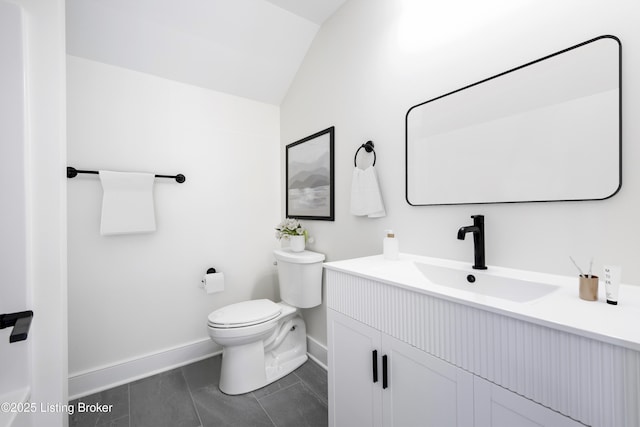 4227 Stilger Cir, Louisville, KY 40299 - bathroom with toilet, lofted ceiling, baseboards, vanity, and tile patterned flooring