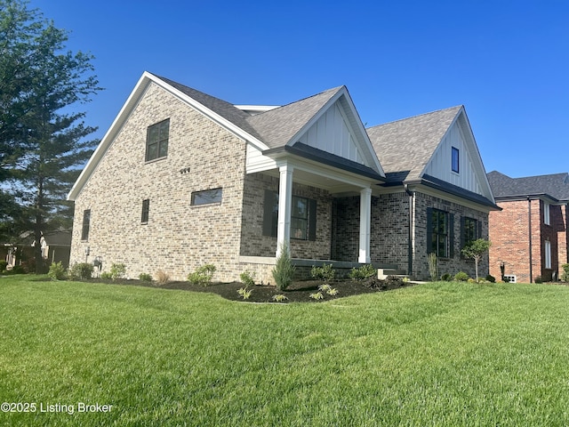 4227 Stilger Cir, Louisville, KY 40299 - view of home's exterior featuring a porch, a lawn, brick siding, and board and batten siding