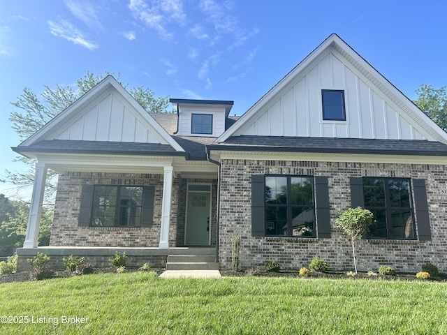 4227 Stilger Cir, Louisville, KY 40299 - view of front facade featuring board and batten siding, brick siding, a porch, and a front yard