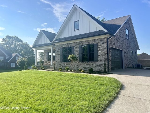 4227 Stilger Cir, Louisville, KY 40299 - view of front of house with board and batten siding, driveway, a front lawn, and brick siding