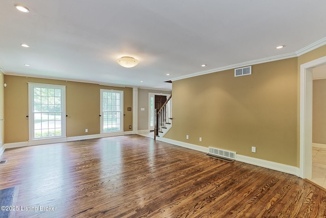 unfurnished living room featuring ornamental molding, wood finished floors, stairs, baseboards, and recessed lighting