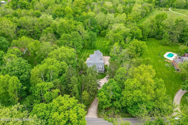 drone / aerial view of a heavily wooded area