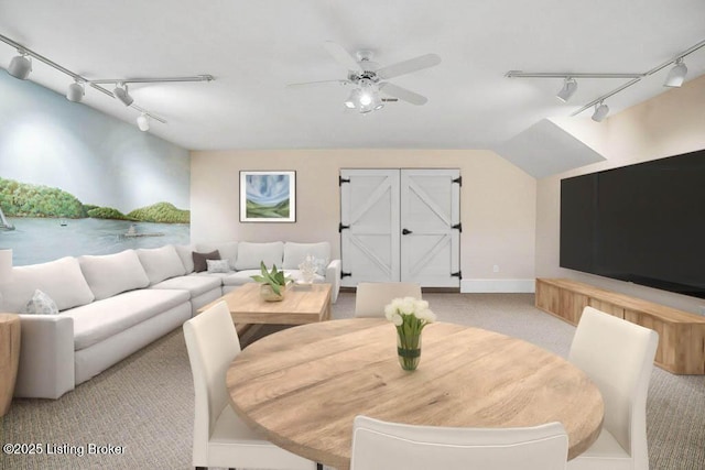 living area with rail lighting, carpet, and a ceiling fan