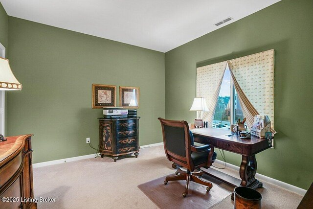office with light colored carpet and baseboards