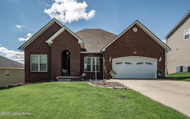 traditional-style house featuring concrete driveway, brick siding, and a front lawn