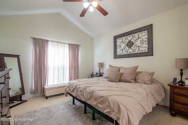 bedroom featuring carpet flooring, vaulted ceiling, and ceiling fan
