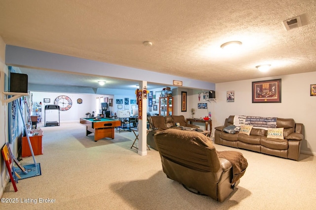 carpeted living area with a textured ceiling and billiards table