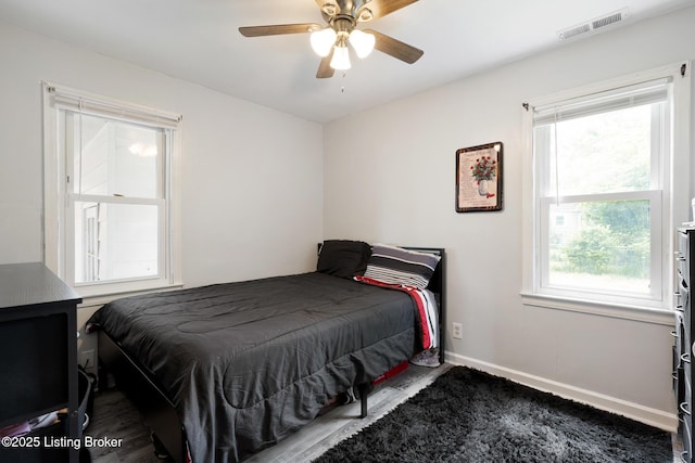 bedroom featuring baseboards and a ceiling fan