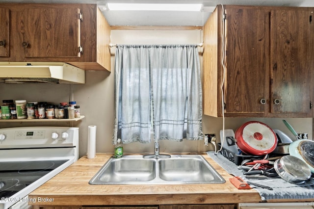 1115 Tilley Dr, Carrollton, KY 41008 - kitchen featuring white range with electric cooktop, under cabinet range hood, light countertops, and a sink