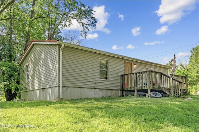 1115 Tilley Dr, Carrollton, KY 41008 - rear view of house with a yard and a wooden deck