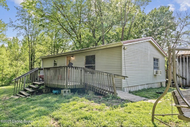 1115 Tilley Dr, Carrollton, KY 41008 - view of front of property featuring a deck, cooling unit, and a front yard