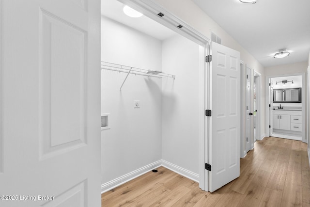 510 University Dr, Radcliff, KY 40160 - washroom with washer hookup, light wood-style floors, baseboards, and hookup for an electric dryer