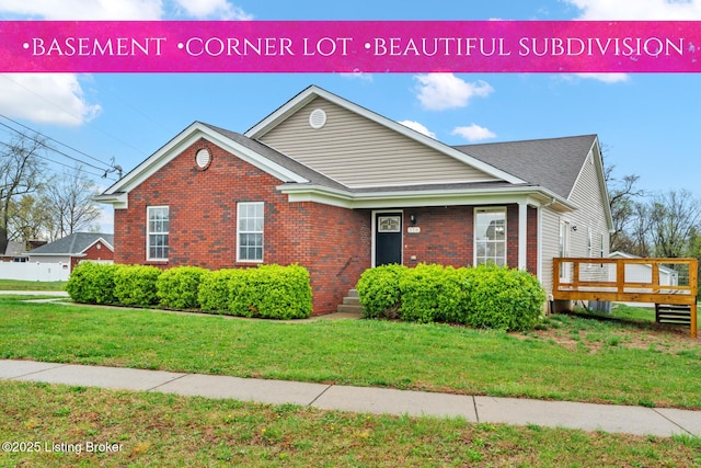510 University Dr, Radcliff, KY 40160 - view of front of property with a front yard, brick siding, a wooden deck, and roof with shingles
