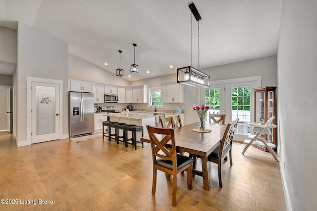 90 Glenn Eagle Rd, Brandenburg, KY 40108 - dining space featuring vaulted ceiling, light wood-style floors, recessed lighting, baseboards, and french doors