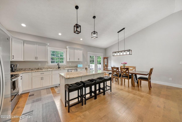 90 Glenn Eagle Rd, Brandenburg, KY 40108 - kitchen with a sink, a kitchen island, light wood-type flooring, white cabinets, and recessed lighting