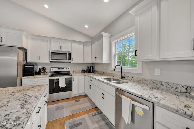 90 Glenn Eagle Rd, Brandenburg, KY 40108 - kitchen featuring appliances with stainless steel finishes, a sink, lofted ceiling, white cabinetry, and recessed lighting