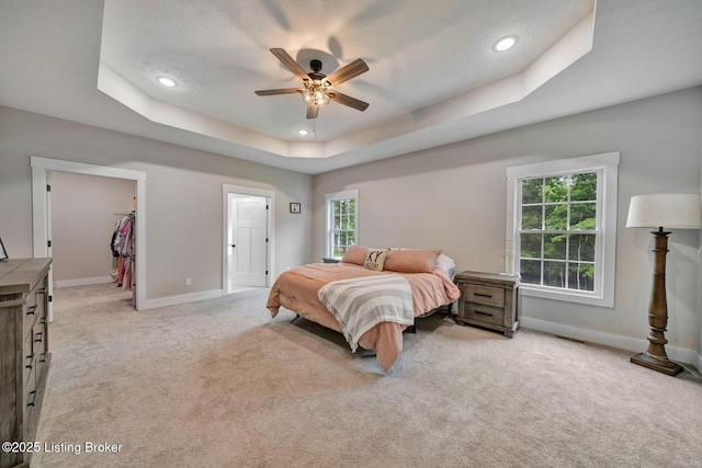 90 Glenn Eagle Rd, Brandenburg, KY 40108 - bedroom with a tray ceiling, baseboards, light colored carpet, recessed lighting, and a walk in closet