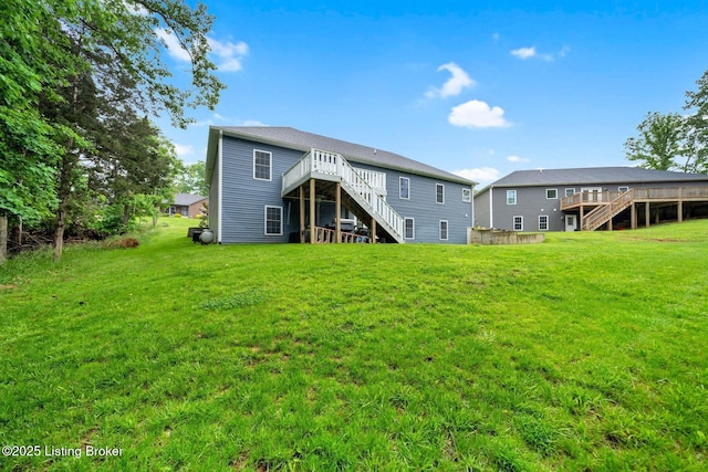 90 Glenn Eagle Rd, Brandenburg, KY 40108 - rear view of house featuring stairs, a wooden deck, and a yard