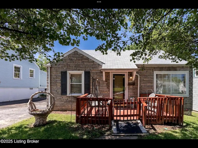 4328 S 1st St, Louisville, KY 40214 - view of front of home with a wooden deck and stone siding