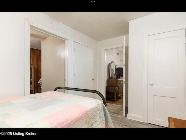 4328 S 1st St, Louisville, KY 40214 - bedroom with light wood-type flooring and a closet