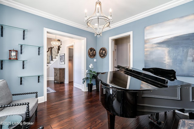sitting room with a chandelier, stairway, ornamental molding, wood finished floors, and baseboards