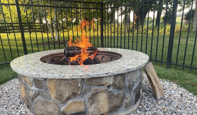exterior view of an outdoor fire pit and fence