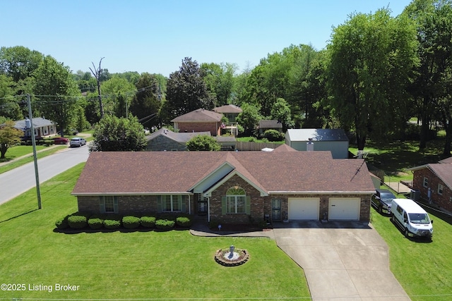 7601 Greenfield Ave, Louisville, KY 40214 - view of front facade featuring an attached garage, driveway, a front yard, and brick siding