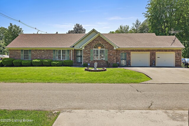 7601 Greenfield Ave, Louisville, KY 40214 - single story home featuring concrete driveway, brick siding, a garage, a front lawn, and roof with shingles